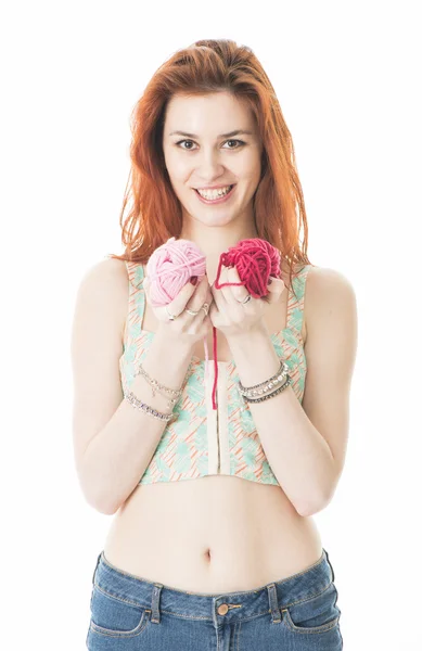 Beautiful young female holding balls of cotton yarn — Stock Photo, Image