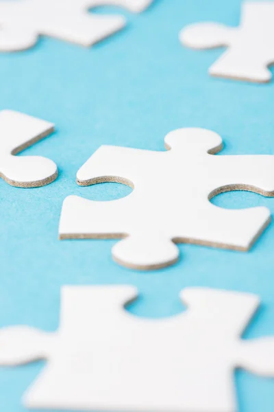 White blank pieces of a puzzle — Stock Photo, Image