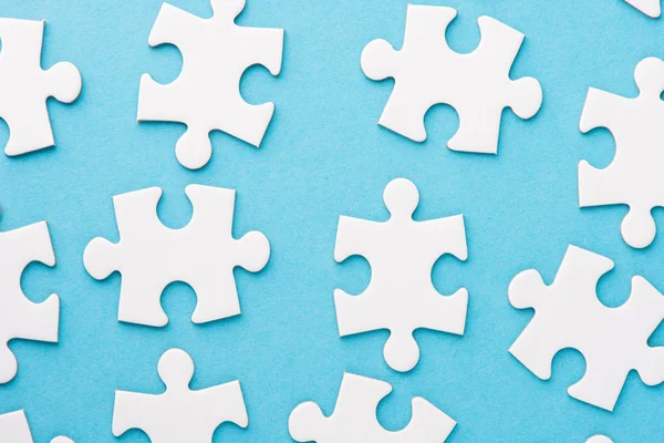 White blank pieces of a puzzle — Stock Photo, Image