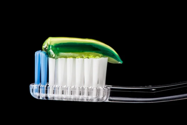 Close up of toothbrush with green tooth paste — Stock Photo, Image