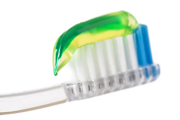 Close up of toothbrush with green tooth paste — Stock Photo, Image