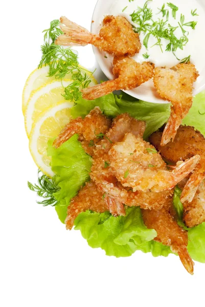 Fried prawns in coconut breading with dipping sauce on white iso — Stockfoto