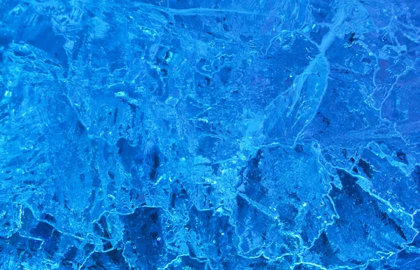 Texture of ice with blue back light. — Stock Photo, Image