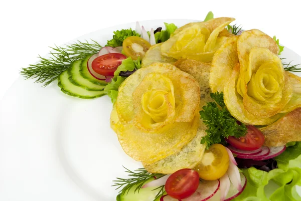 French fries in the form of a rose on a plate with a salad on wh — Stock Photo, Image