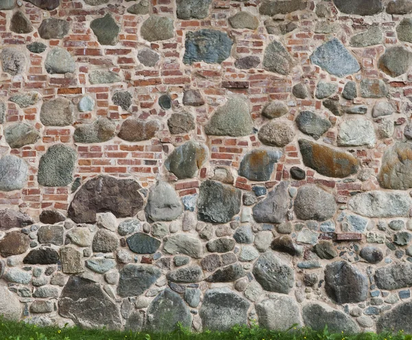 两个不同的图案砖和石头墙壁共谋的背景 — 图库照片