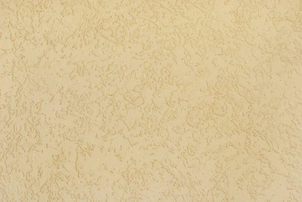 Блідо-жовта оштукатурена стіна з візерунком як фон — стокове фото