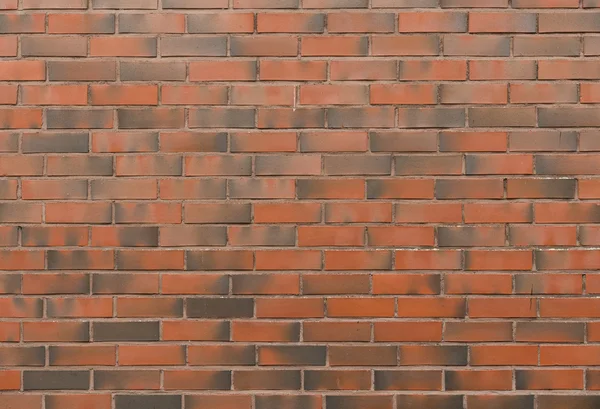 Background of new brick wall in red dark tones — Stock Photo, Image
