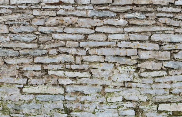 Alte Kalksteinmauer als Hintergrund — Stockfoto