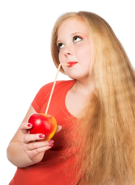 Attractive teen girl in the orange t-shirt holding an red apple — Stock Photo, Image