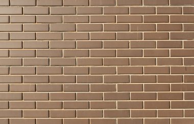 parlak güneşli bir günde arka plan olarak modern tuğla duvar