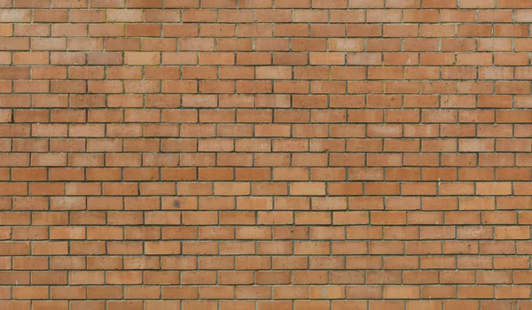 Wall from a red brick with a corrugated pattern as background — Stock Photo, Image