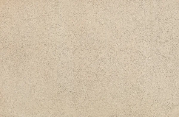 Textura de estuco de pared beige en un día soleado como fondo —  Fotos de Stock