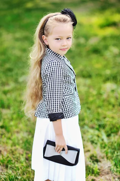 Adorable little girl with a handbag — Stock Photo, Image