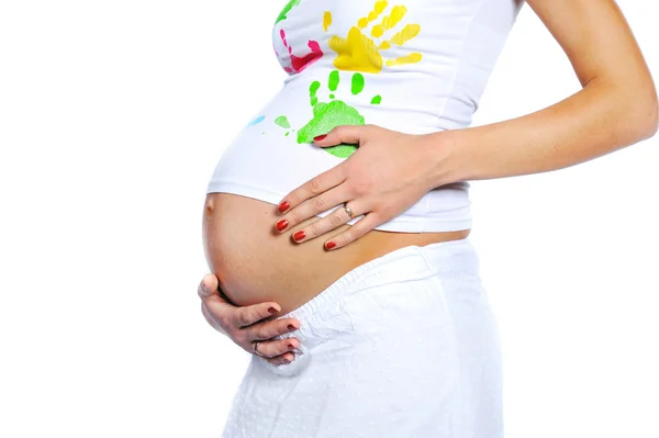 Closeup of pregnant woman stomach isolated on white — Stock Photo, Image