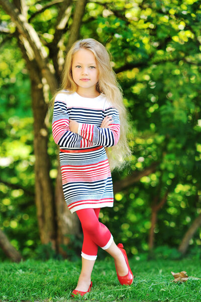 Sweet little girl posing outdoors