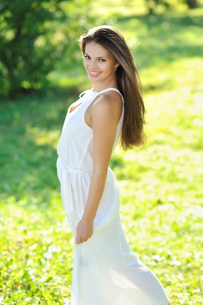 Young beautiful model girl posing outdoors — Stock Photo, Image