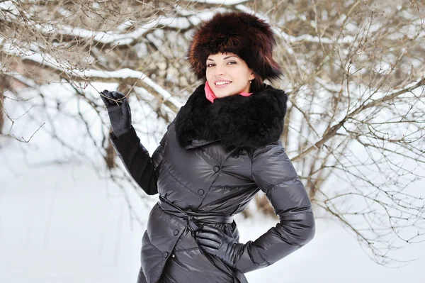 Smiling beautiful young woman. Outdoor in a winter day Stock Picture