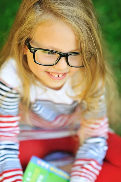Closeup of cute little girl in glasses - outdoor — Stock Photo, Image
