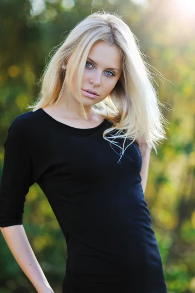 Young pretty girl posing outdoors - portrait Stock Image