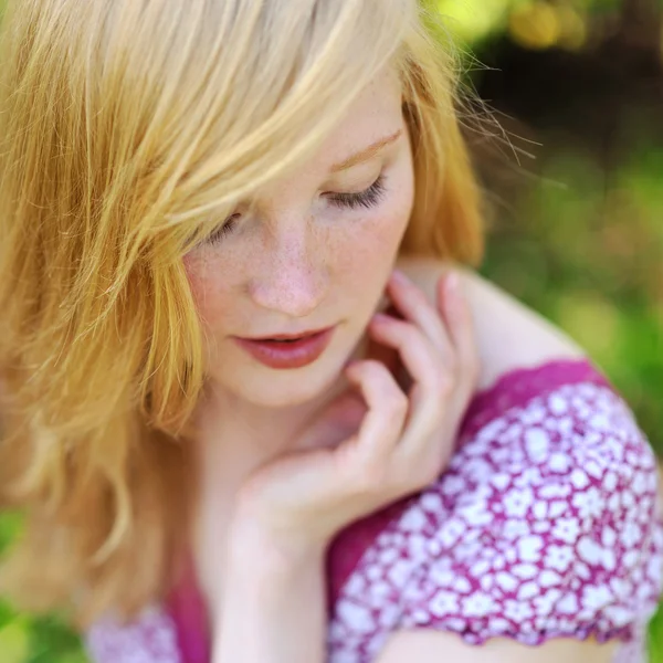 Beautiful spring girl in blooming tree — Stock Photo, Image