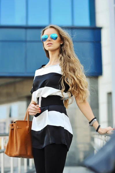 Beautiful lady with bag after shopping Stock Photo