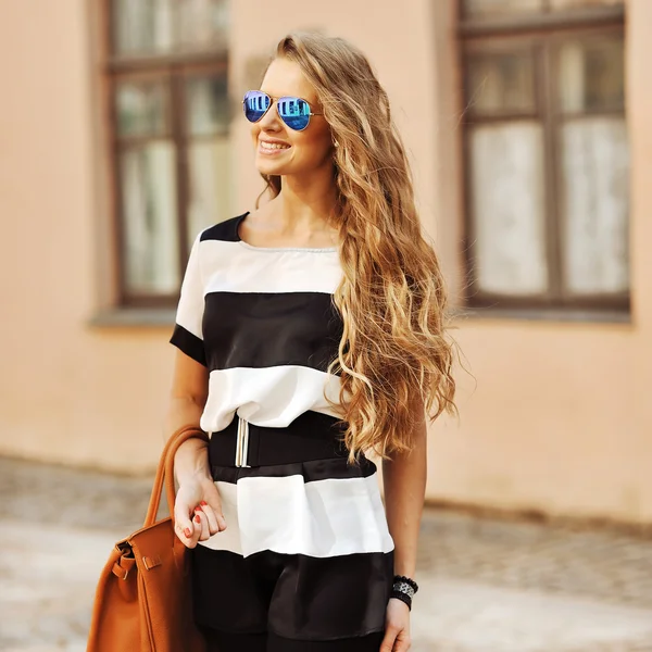 Beautiful girl with a bag — Stock Photo, Image