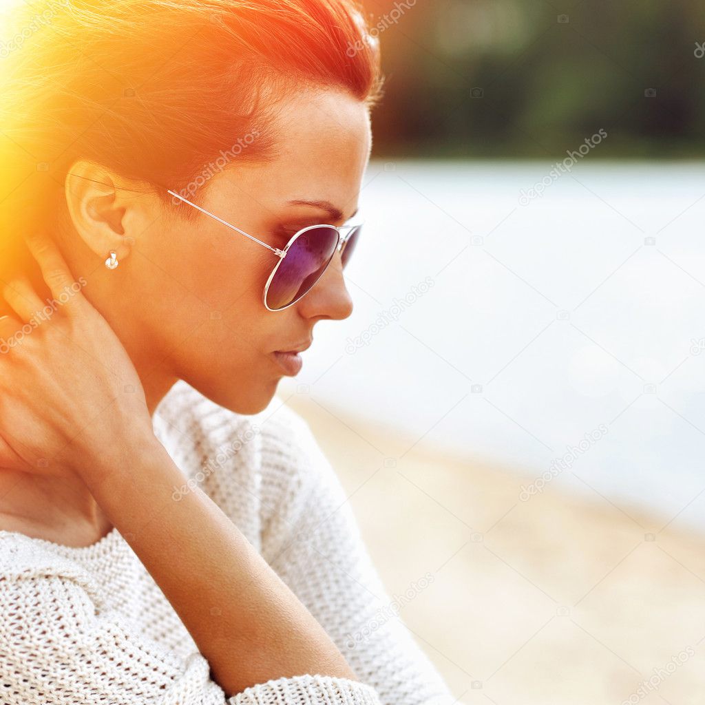 Beautiful sensual fashion woman in sunglasses. Multicolored pop