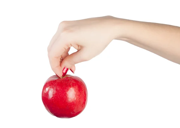 Mano femenina con una manzana — Foto de Stock