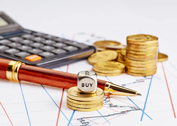 Dices cube with word BUY, rising stacks of coins, black calculat — Stock Photo, Image