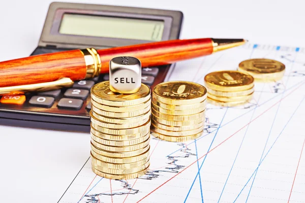 Downtrend coins stacks, calculator, pen and dices cube with the — Stock Photo, Image