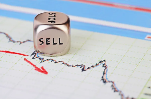 Downtrend financial market chart with red arrow and dices cube w — Stock Photo, Image