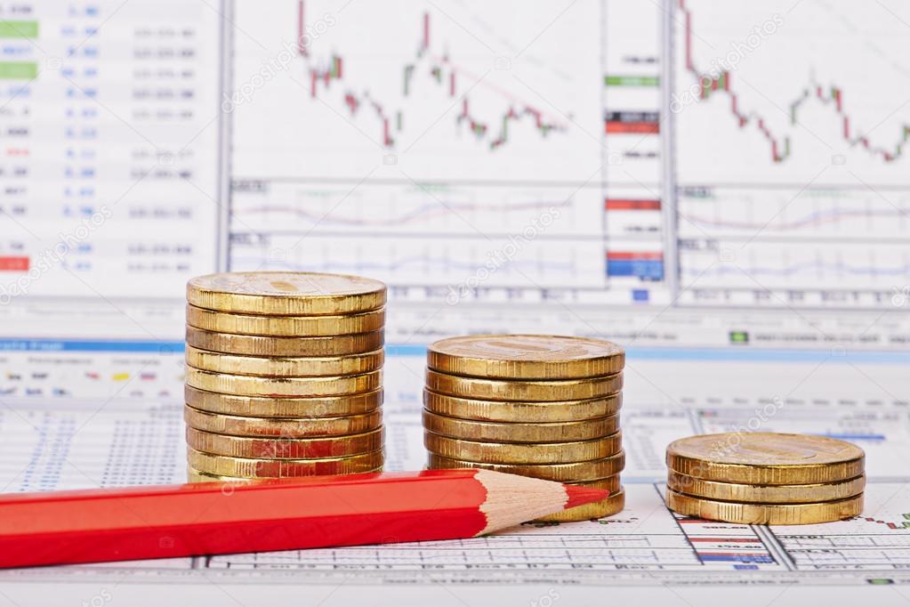 Downtrend coins stacks, red pencil, financial chart as backgroun