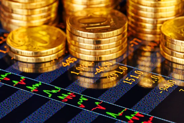 Golden coins and financial chart. Selective focus — Stock Photo, Image