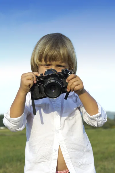 Young boy with vintage photo camera — Stock Photo, Image