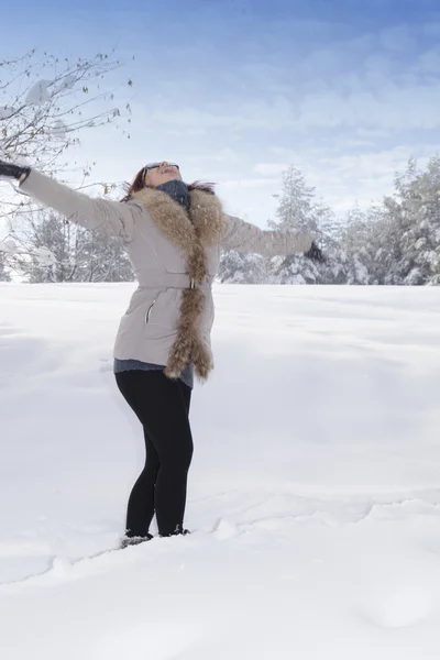 Mid aged cute smiling woman saluting the sun — Stock Photo, Image