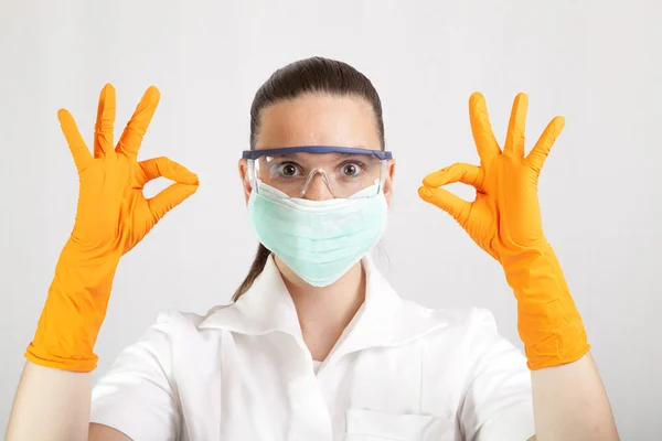 Female surgeon wearing latex gloves — Stock Photo, Image