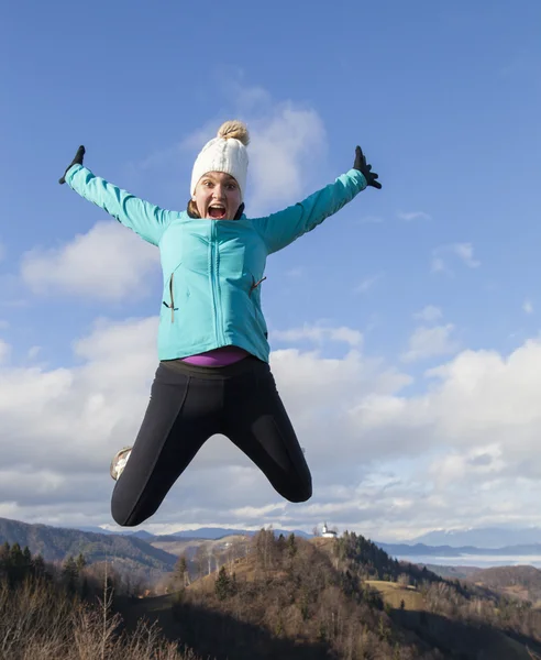 Young women joyfully jumping outdoors — Stock Photo, Image