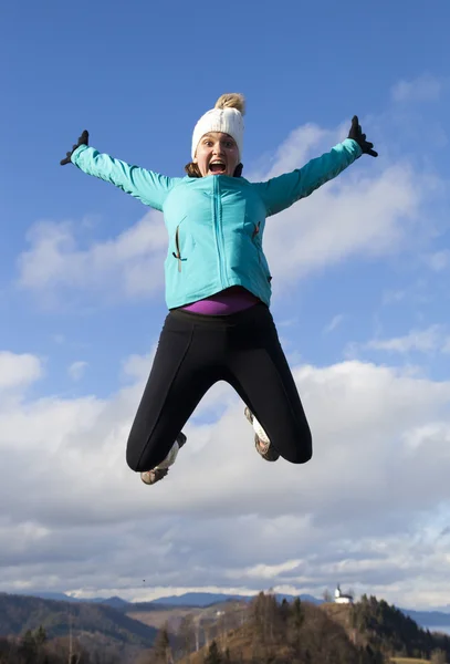 Young women joyfully jumping outdoors — Stock Photo, Image