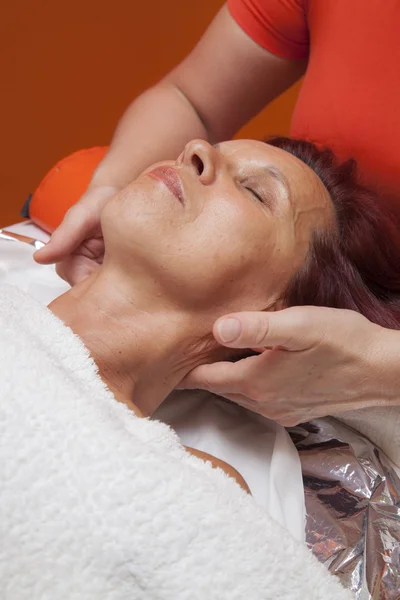 Cute woman gets professional facial massage, lymphatic drainage — Stock Photo, Image