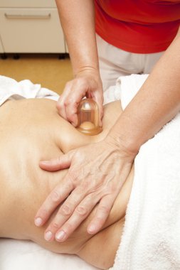 Anti cellulite massage with Ventuza vacuum body puller clipart