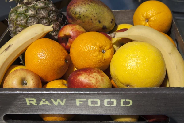Fresh organic fruit in wooden box — Stock Photo, Image
