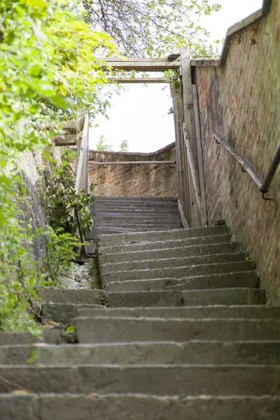 Stock image Old uneven stone staircase