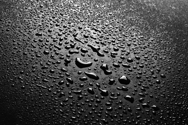 Gotas de agua en negro — Foto de Stock