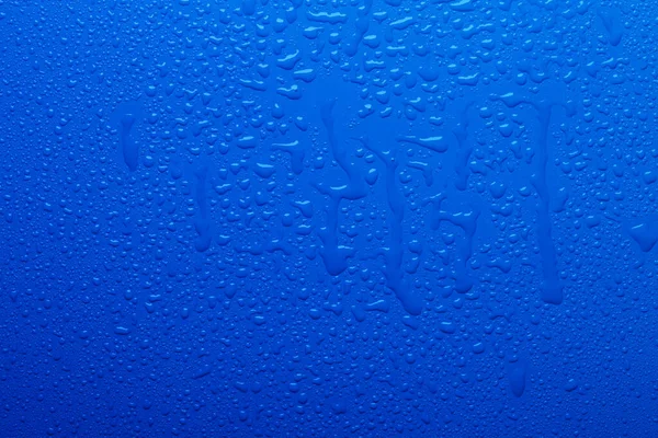 Vízcseppek Kék Színű Felületen — Stock Fotó