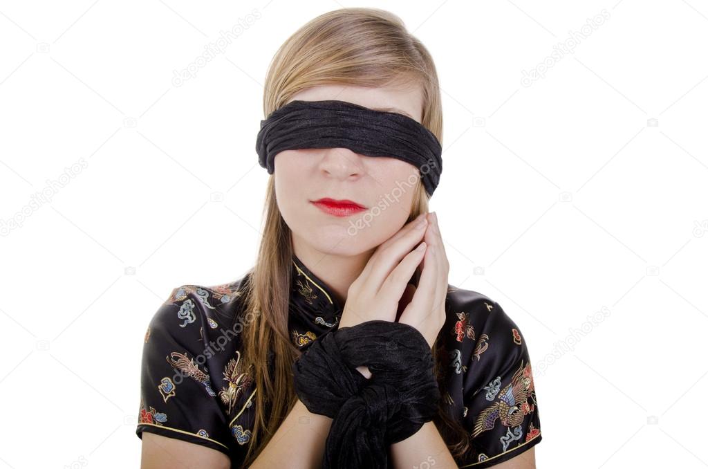 A Blindfolded Woman with Her Hands on Her Face · Free Stock Photo