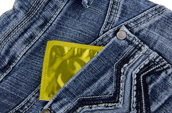 Condom in a jeans pocket — Stock Photo, Image