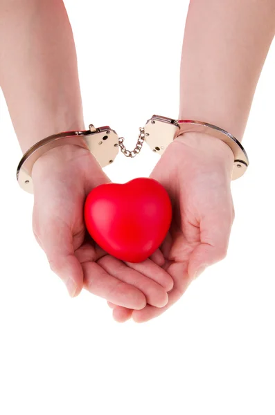 Female hands holding red heart — Stok fotoğraf