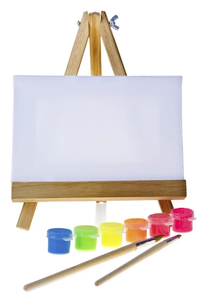 Canvas,brushes and easel — Stock Photo, Image