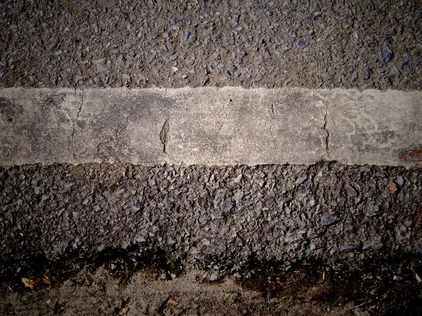 Grungy, dirty view of asphalt — Stock Photo, Image