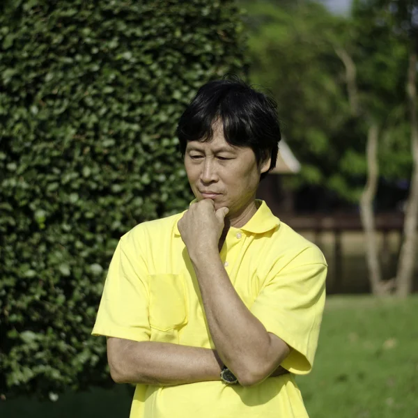 Senior man, being thoughtful, outdoors. — Stock Photo, Image